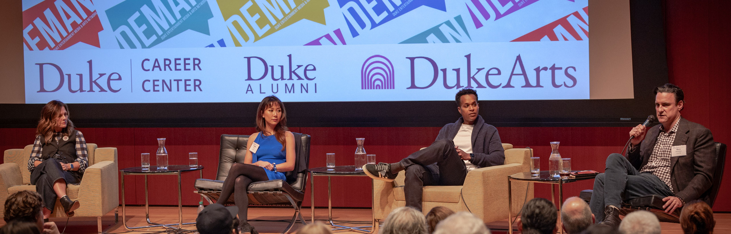 Panel of four speakers at DEMAN.