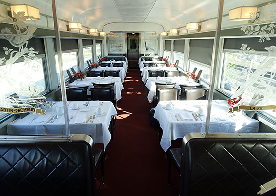 Train dining car with tables set