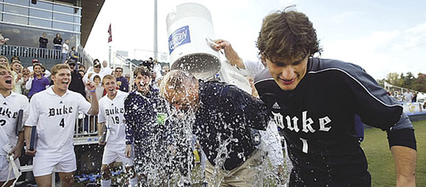 Coach soak: After defeating higher-ranked UNC in overtime to win the 2005 ACC tournament, players gave Rennie a celebratory shower. Jon Gardiner
