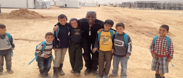 Vieux connects with Syrian children on the way to school at the Za'atari Refugee Camp in Jordan
