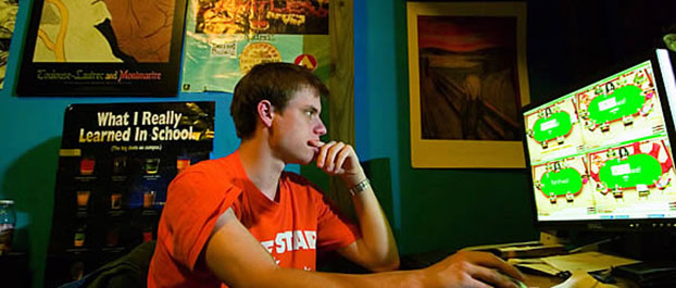 Poker prodigy: Jason Strasser plays the odds from his dorm room. Jon Gardiner