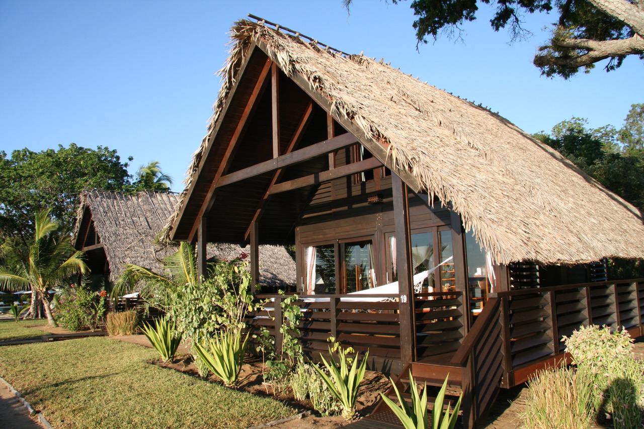 View of front of house hut with straw roof