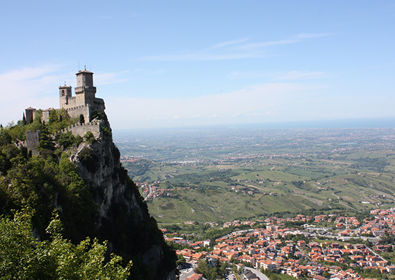 View of peak of mountain and city at the foot below