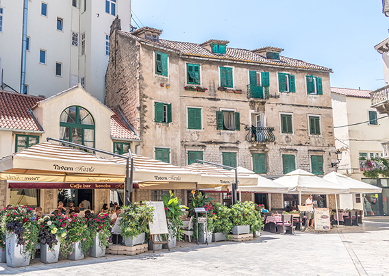 Buildings with cafes out front