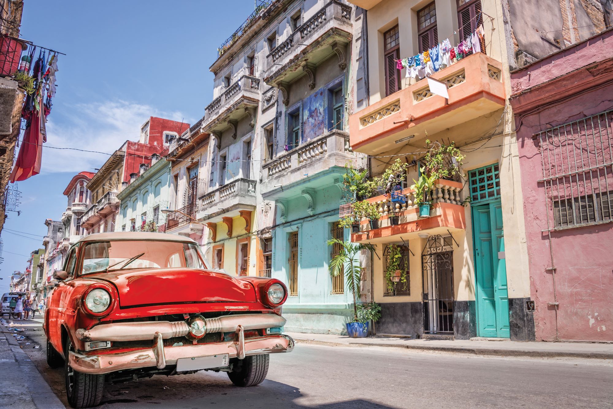 Vintage classic red american car in a street of Havana