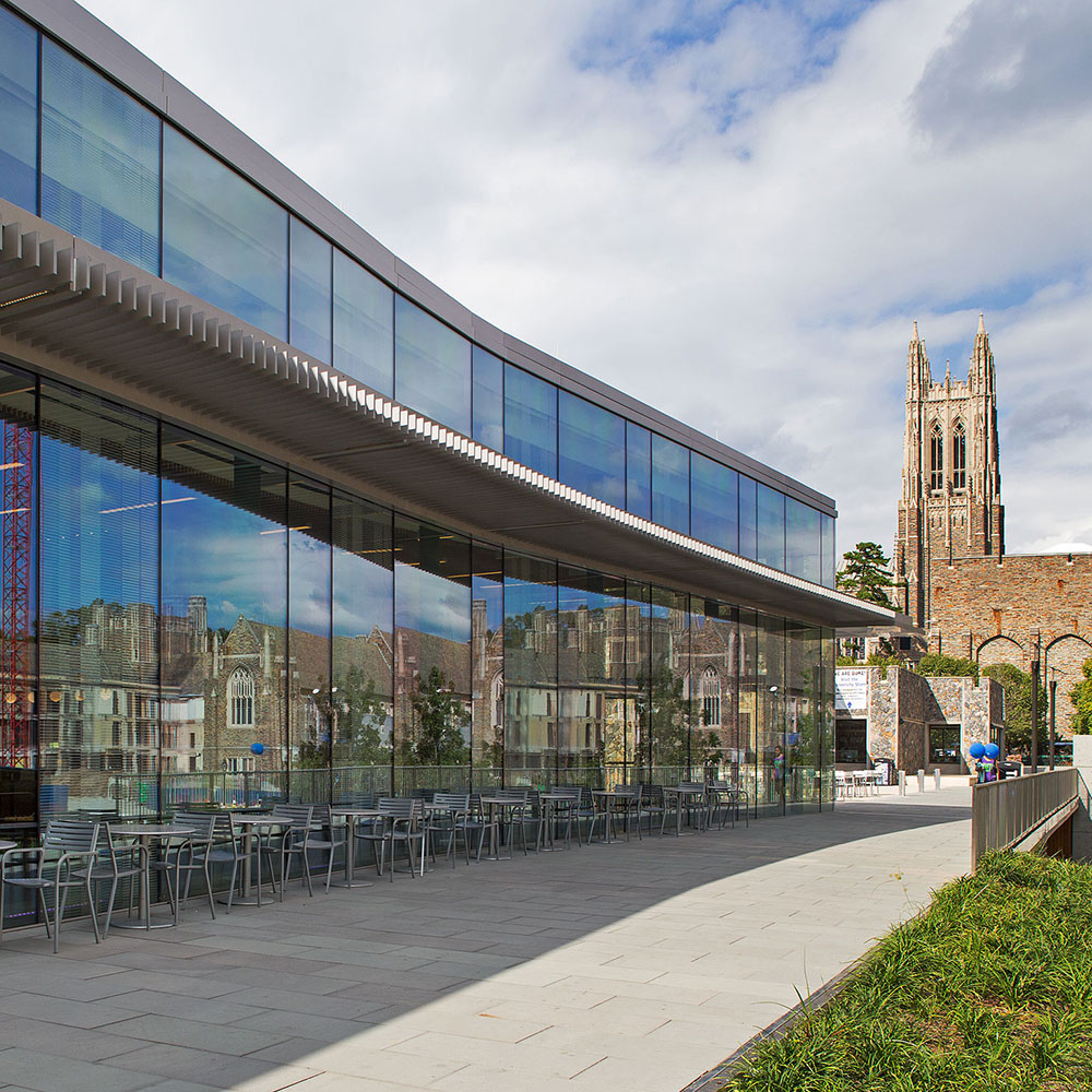 Photo of the exterior of the conference site, Penn Pavilion, with the Duke Chapel in the background