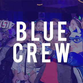 Blue Crew logo and social event in background